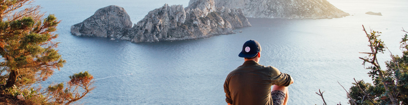 Person gazing over the Mallorcan coastline — a moment of reflection and calm